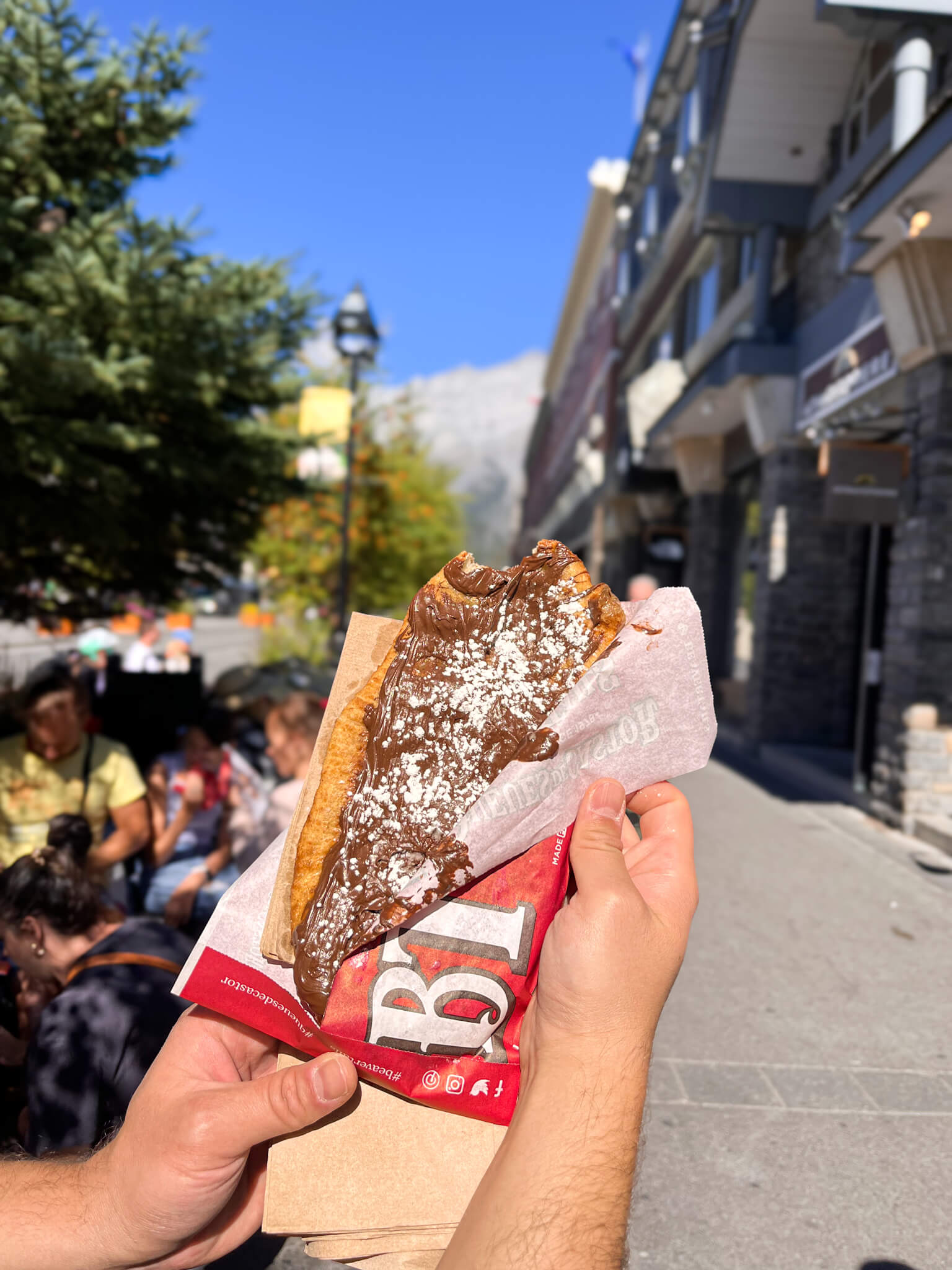 holding up a beaver tail, what to eat in Banff