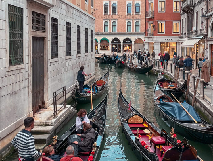 Gondolas in a Venice canal, a featured image for Ultimate Packing Venice list: what to pack for Venice, part of a Venice travel guide series
